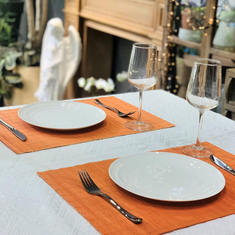 ANDSTAR Non-Slip Waterproof Placemats Set of 6 - Reusable Wipeable Table Mats for Dining Table, Kitchen, Outdoor Picnic, 12x18 Inch PVC Backed Heat Resistant Place Mats Dishwasher Safe(Orange)