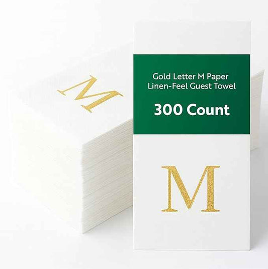 Restaurantware Napkins Pack of 300 Gold Letter M Linen-Feel Paper Disposable Guest Towels 15.75 x 7.87 Inches, Elegant Airlaid White Napkins For Birthdays, Weddings and Catering Events