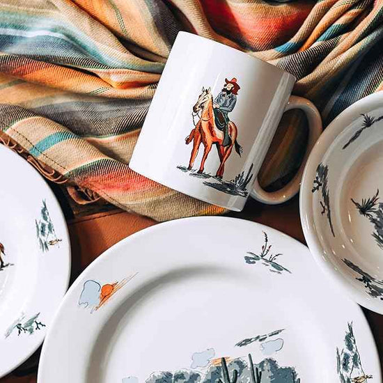 Paseo Road Ranch Life 16 Piece Ceramic Dinnerware Set with Plates, Bowls, Coffee Mugs, Duffle Bag, Cow Longhorn Horse Cowboy Pattern, Southwestern Rustic Cabin Lodge Style