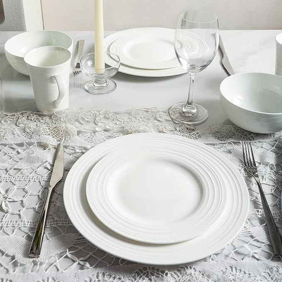 Stone Lain Eleanor Bone China 16 Piece Dinnerware, Plates and Bowls for 4, White Dish Collection with Mugs, Elegant Swirl Design, Microwave & Dishwasher Safe